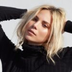 blonde woman in black turtleneck sweater