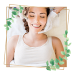 smiling woman receiving a facial treatment