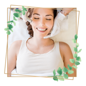 smiling woman receiving a facial treatment